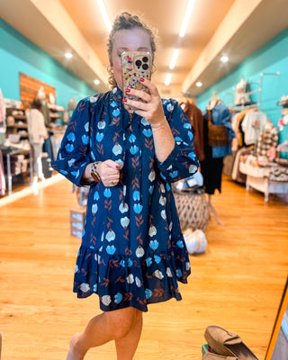 A Floral Whimsy Drop Hem Mini Dress - The Southern Loft