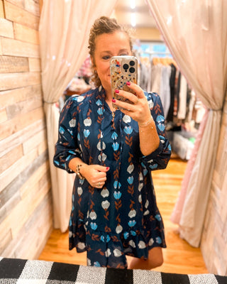 A Floral Whimsy Drop Hem Mini Dress - The Southern Loft